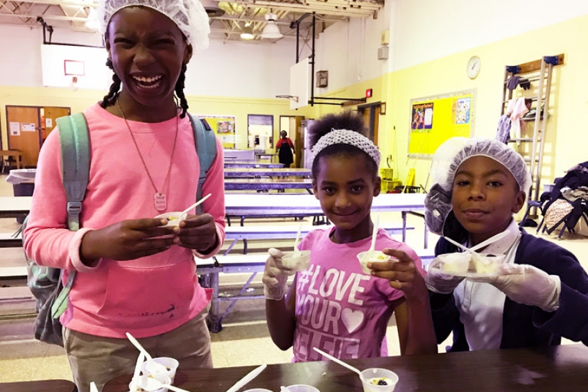 Comegys Elementary students are all smiles during AUNI's 5th Grade Lunch Club.